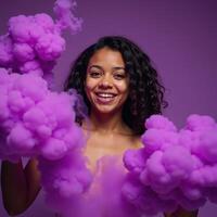 A Purplehaired African American girl is engulfed in a cloud of purple smoke bombs in an artsy photograph photo