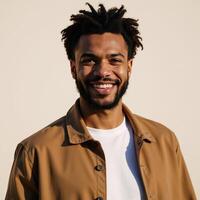 Cheerful Gen Z guy with positive emotions stands outdoor smiling at camera Portrait photo