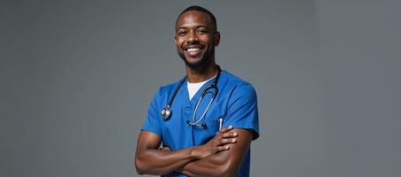 A friendly confident AfricanAmerican male nurse stands tall smiling warmly while wearing blue scrubs and a stethoscope exuding care and compassion in his expression photo