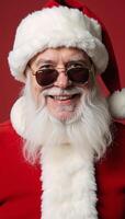 Traditionalstyle square photo featuring a cheerful gay Santa Claus wearing red and sporting sunglasses