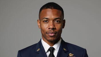 Young African American veteran gazes confidently at the camera in portrait style photograph photo