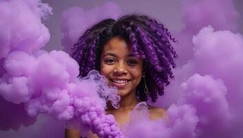 A Purplehaired African American girl is engulfed in a cloud of purple smoke bombs in an artsy photograph photo