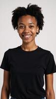 African American woman dressed casually in black tshirt and jeans photo