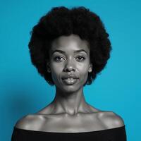 An African American woman with an Afro is depicted against a blue backdrop photo