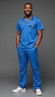 A friendly confident AfricanAmerican male nurse stands tall smiling warmly while wearing blue scrubs and a stethoscope exuding care and compassion in his expression photo