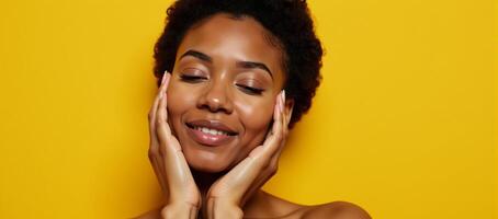 African American woman with closed eyes touchingly portrait on yellow backdrop with natural makeup photo