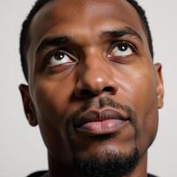 Closeup portrait showcasing an introspective African American male photo