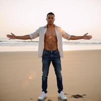 AfricanAmerican young man poses confidently with open arms on the beach photo