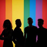An LGBTQ representation illustration featuring lesbians and gays in a supportive inclusive setting with vibrant rainbow colors against a black background photo