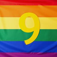 Digital illustration featuring the number nine rendered in LGBT Pride colors rainbow photo