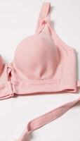 Isolated pink bra on a white background photo