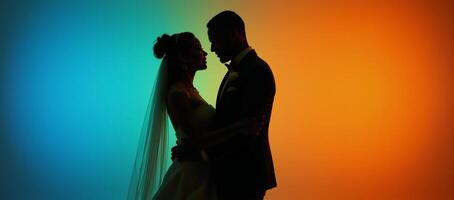 A romantic lovefilled scene showcasing an elegant African American bride and groom as silhouettes surrounded by vivid colors photo