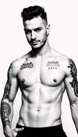 Modern man portrait featuring tattoos and piercings against a monochrome backdrop photo