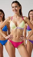 Three women wear stylish sporty bras designed to highlight the chest and waist ideal for summer or swimwear styles photo