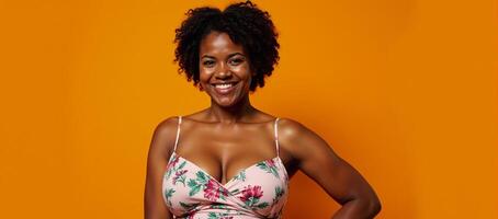 Portrait African American Plus Size Model in Floral Dress on Orange Background photo
