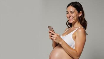 Portrait pregnant woman smiling with smartphone against background photo