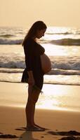 Pregnant woman embracing motherhood on a seaside backdrop photo