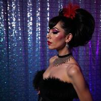 Drag queen silhouette in a vibrant nightclub setting photo