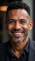 A confident AfricanAmerican man poses for an urban portrait exuding happiness and maturity as a middleaged successful business professional photo