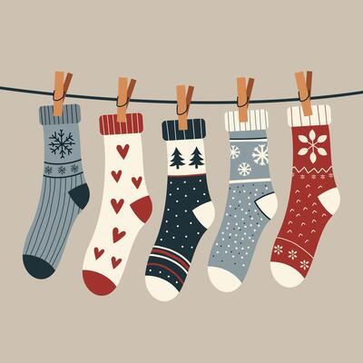Set of winter cotton and woolen socks with different drawings, patterns, colors, and designs. Collection of cute winter footwear isolated on background. Colorful flat textured illustration.