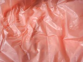 Old rose colored plastic bag texture for abstract background. photo