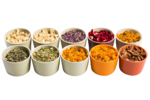 A row of bowls filled with various spices and herbs. The bowls are arranged in a line, with some being larger than others png