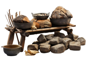 A wooden table with a variety of food items on it, including bread, potatoes, and a bowl. The table is surrounded by rocks and logs, giving it a rustic and primitive feel png