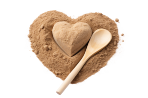 A wooden spoon is sitting on top of a pile of sand, with a heart-shaped object in the middle. Concept of warmth and comfort, as the spoon and heart symbolize care and nurturing png