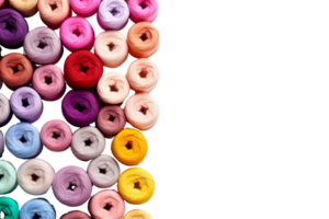 A bunch of colorful yarns are displayed in a row. The colors are bright and vibrant, creating a cheerful and lively atmosphere. The arrangement of the yarns suggests a sense of abundance and variety png