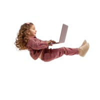 full body little girl laying in the air floating while using laptop isolate on transparency background png