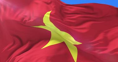 Vietnamese flag waving at wind with blue sky, loop video