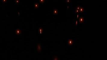 Falling bright particles with reflection on black background. Design. Bright glowing particles fall in dark. Glowing stars fall in dark space with reflection video