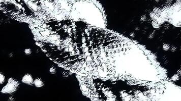 Spinning metal shimmering figure. Motion. Rotating glowing bending structure. video