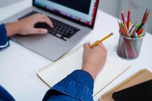 Teenage using tablet for communication, search data internet website to learn. photo