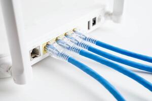 Ethernet cable with wireless router connect to internet service provider network. photo