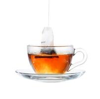 Glass of Tea with Bag End. Isolated on white background, with clipping path photo