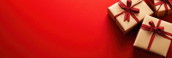 Horizontal banner in red with gifts in craft paper with bows photo