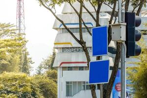 road signs with U turn instructions, follow the lights and road signs to a place in Kota Baru Parahyangan, West Bandung Regency photo