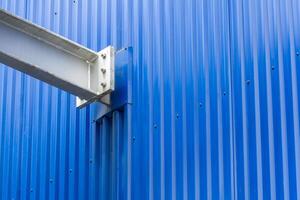 A close up of steel beams creating a geometric pattern in a modern urban architectural structure. The composition showcases industrial design and engineering precision photo