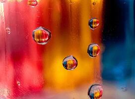 Colorful display showing how water and oil do not mix vivid tones macro shot hdr soothing,Colorful background with water drops on it photo