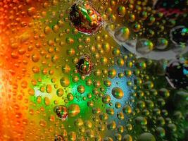 Colorful display showing how water and oil do not mix vivid tones macro shot hdr soothing,Colorful background with water drops on it photo