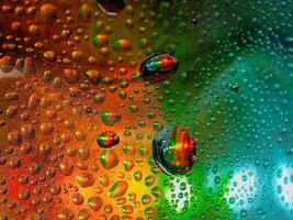 Colorful display showing how water and oil do not mix vivid tones macro shot hdr soothing,Colorful background with water drops on it photo