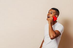 hispanic man taking a phone call. man using a smartphone. photo