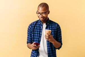 young black man smile using smart phone. technology concept. photo