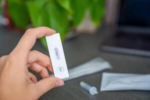 Rapid Antigen Test kit with with Positive result during swab COVID-19 testing. Coronavirus Self nasal or Home test, Autumn exacerbation of viruses. High quality photo