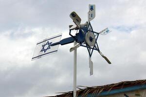 fan blades that are turned by the wind photo