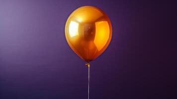 Golden balloon shimmering against a vibrant background during a festive celebration photo