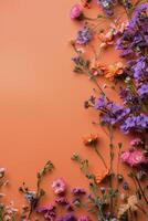 A vibrant arrangement of colorful flowers on a bright orange background photo