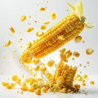 a corn on the cob being tossed with corn kernels photo