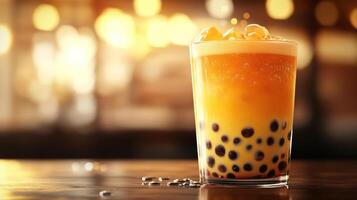 Brightly colored frozen beverage in a glass with fruit on top, served at a blurred bar setting. photo